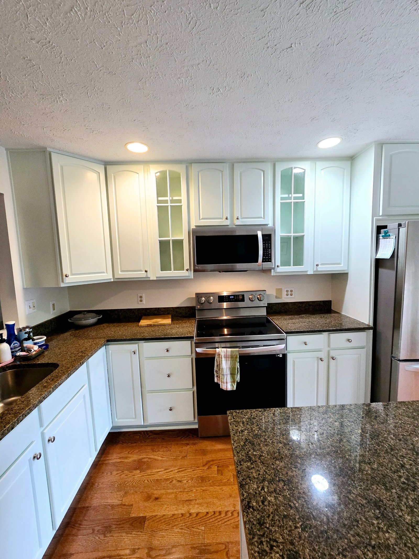 White sprayed kitchen cabinets with glass fronts, Upper St. Clair PA