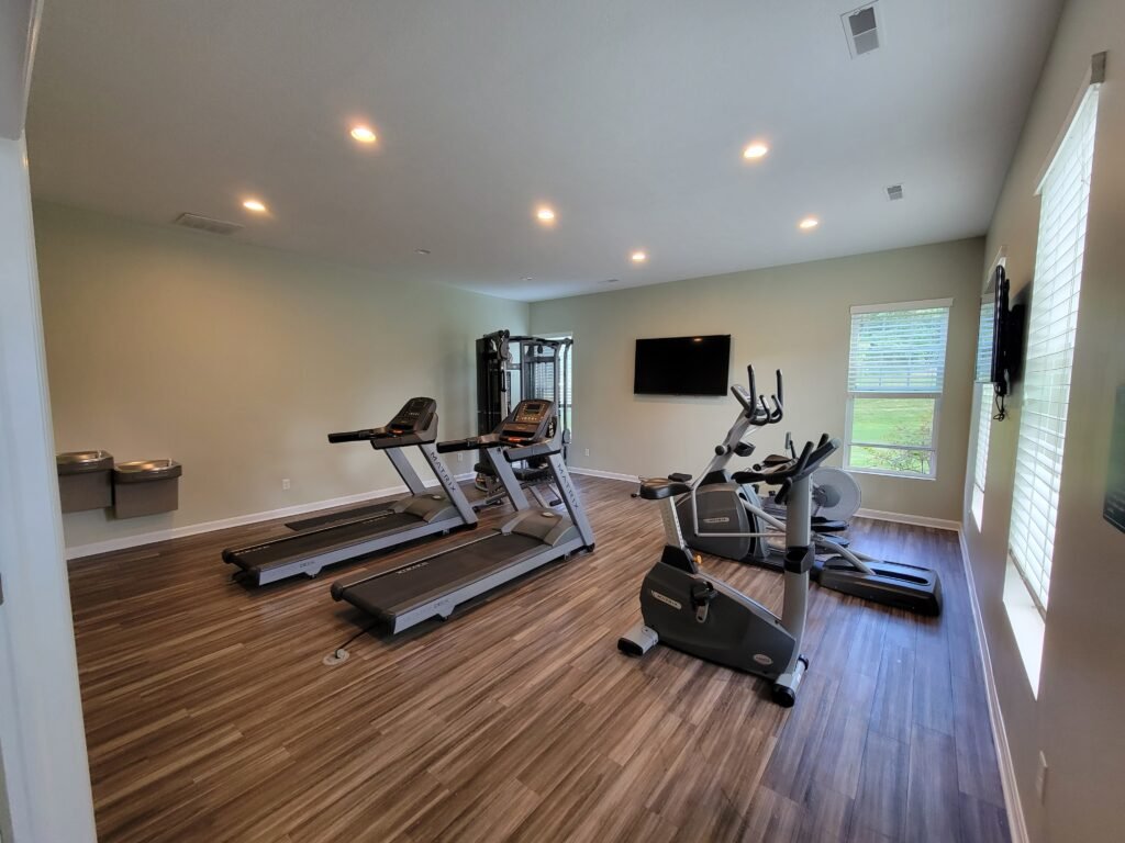 Freshly painted fitness room with treadmills and wood flooring, Wexford PA