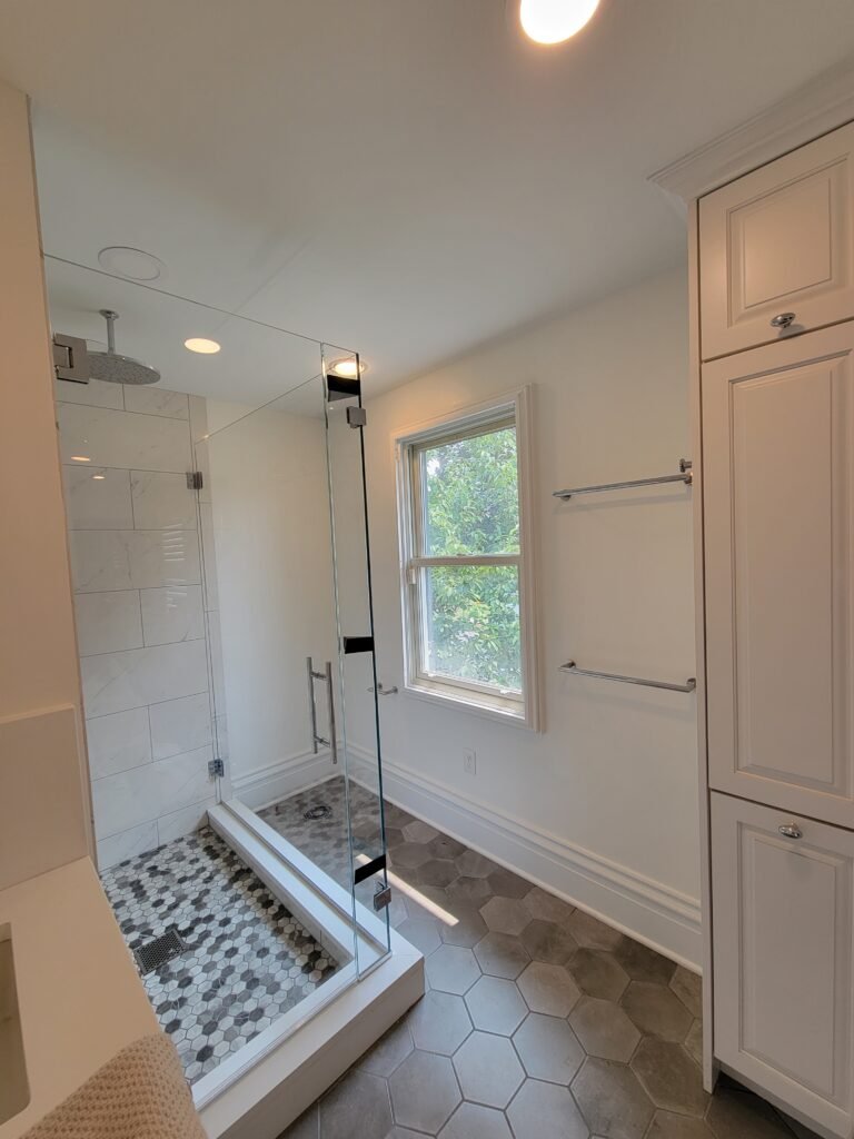 White bathroom with glass shower and hexagon tile floor, Edgeworth PA