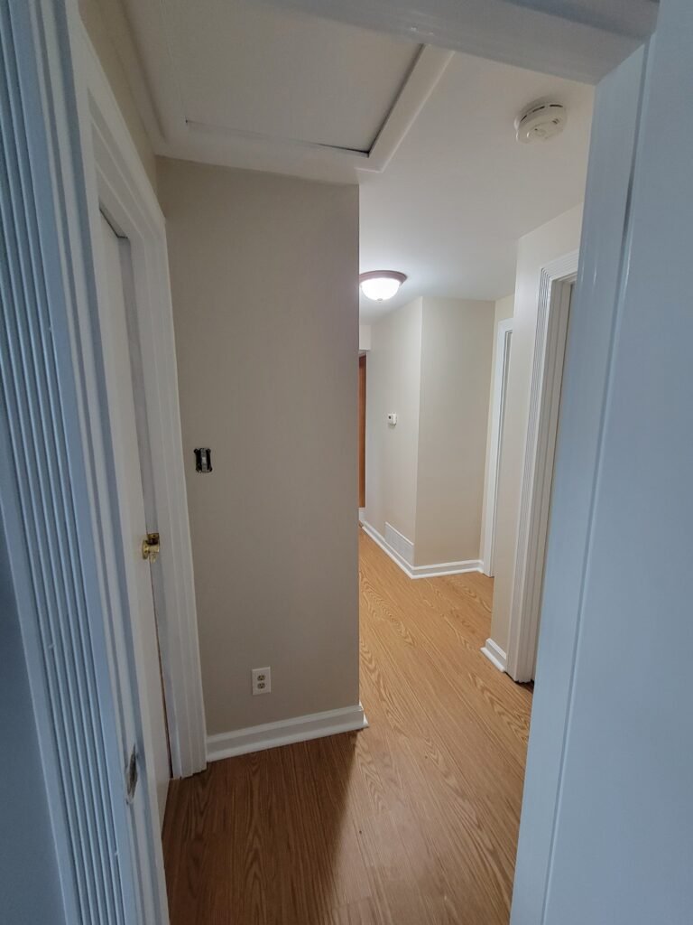 Freshly painted taupe hallway with wood flooring, Glenshaw PA