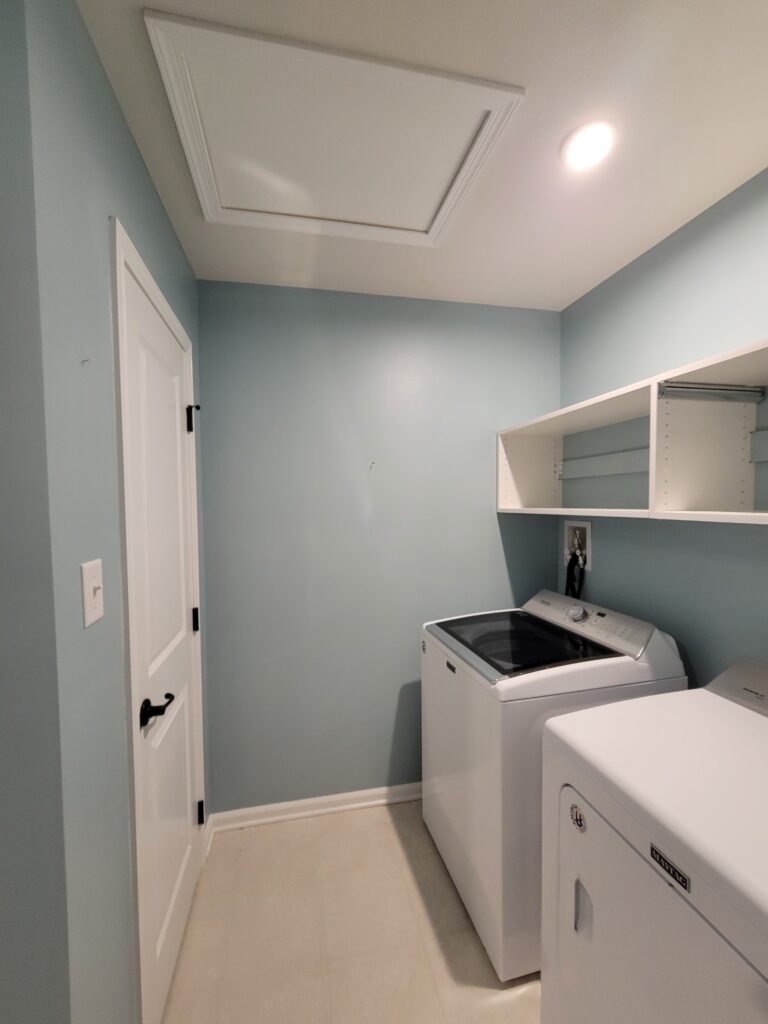 Laundry room painted soft blue-gray with white shelving, Glenshaw PA